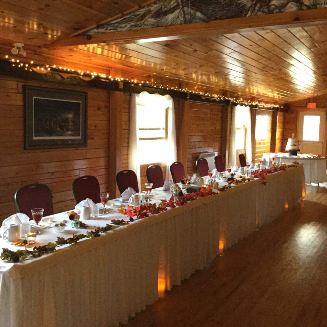 A long table with many plates and cups on it